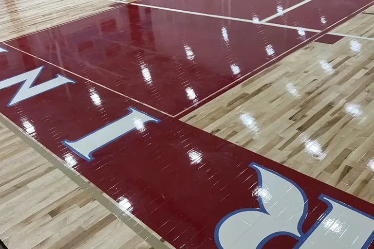 Bright red paint on a gym floor