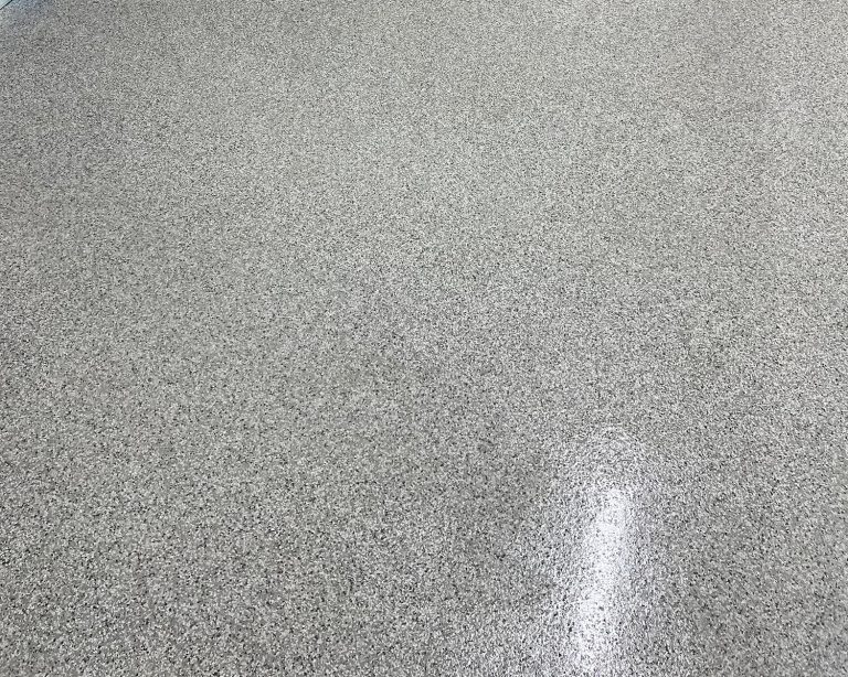 Close up of mixed white gray and black epoxy floor in a garage